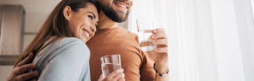 Young Warrenville couple enjoying a clean glass of water.