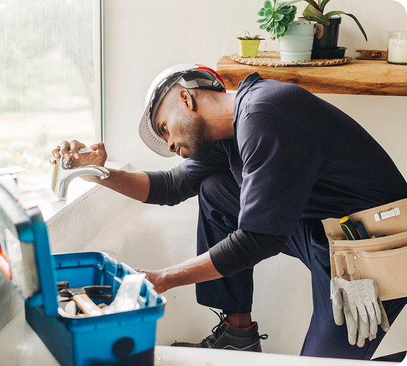 technician working on faucet