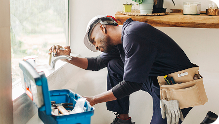 technician working on faucet