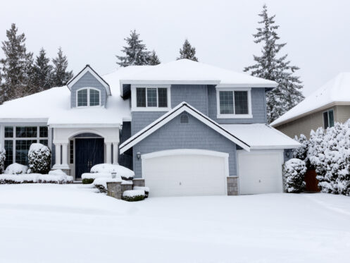 A snow-covered Warrenville home